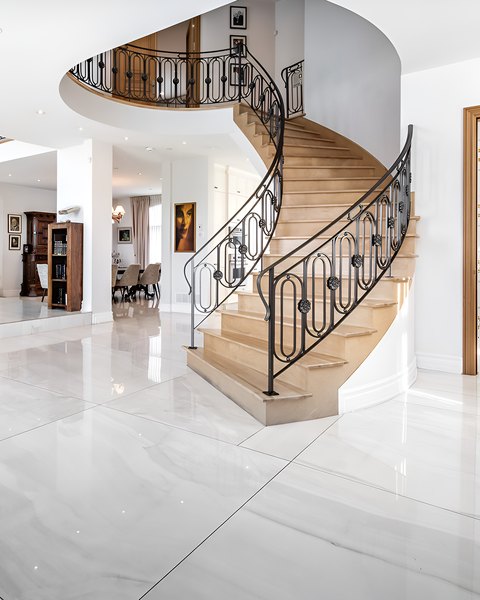 Spiral staircase with a wrought-iron railing